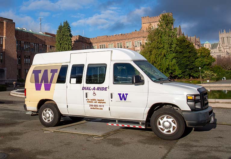 white dial-a-ride van equipped with wheelchair lift