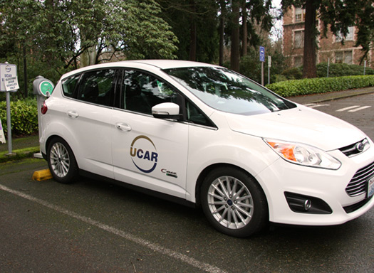 u-car rental electric vehicle parked and charging