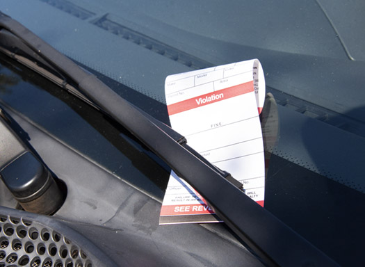 parking citation on a car windshield