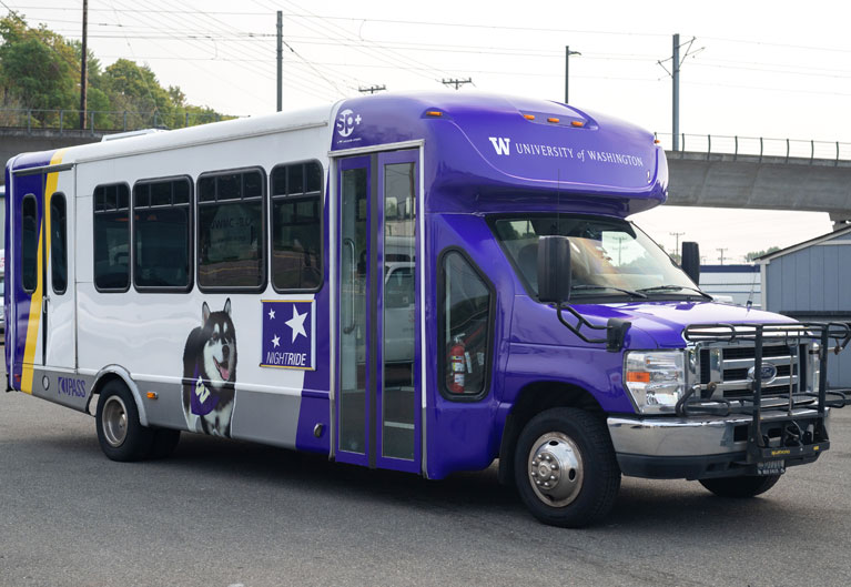 NightRide shuttle with purple and Dubs design 