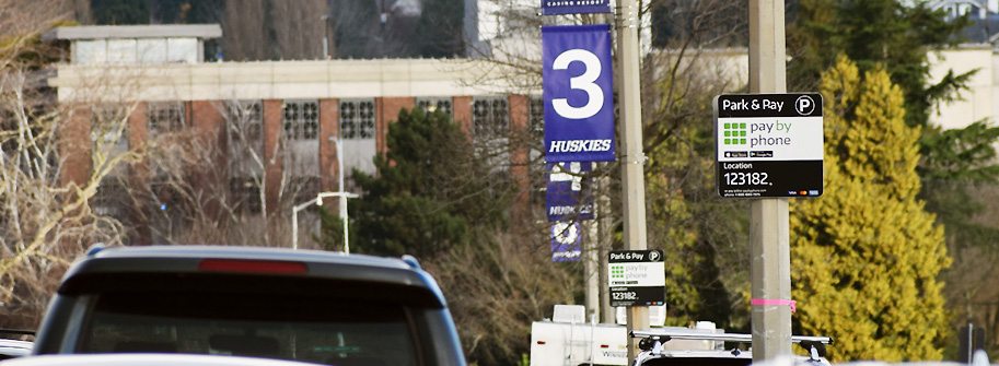 pay and park pay-by-phone parking sign displaying convenient payment options