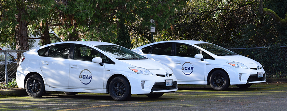 two white cars with UCAR logo