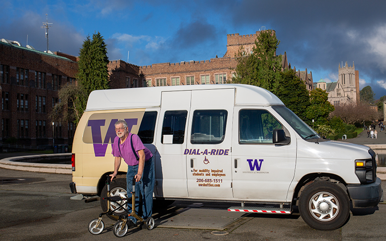 Man using upright walker, in front of the Dial-A-Ride shuttle