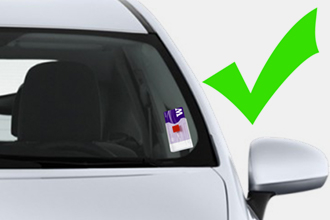 car with avi card on drivers side of windshield