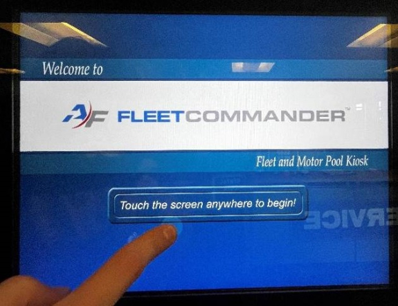 fleet commander touch screen with a person's finger about to tap the touch the screen anywhere to begin button