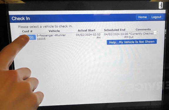 check in screen with person's finger ready to tap the first row button in the confirmation number column for the one vehicle listed