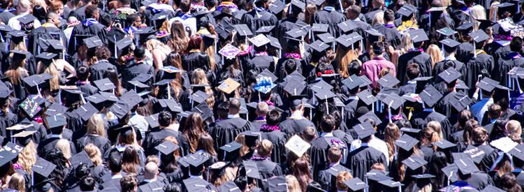 large crowd of uw graduates in caps and gowns