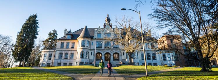 denny hall with two people walking