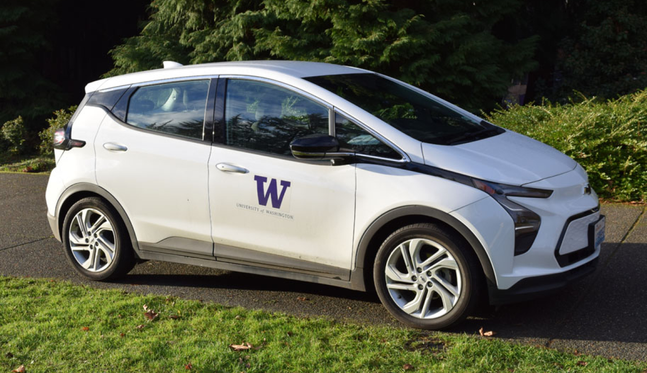 white chevrolet bolt ev parked on access drive