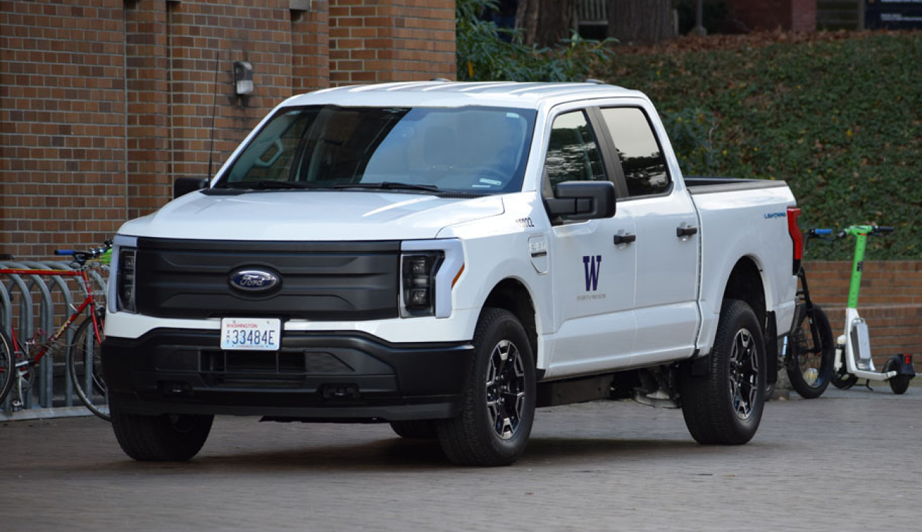 white ford f150 lightning ev parked in red square