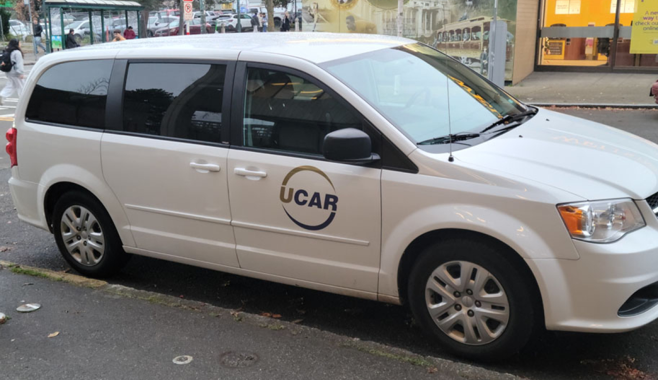 seven passenger minivan parked on side of street