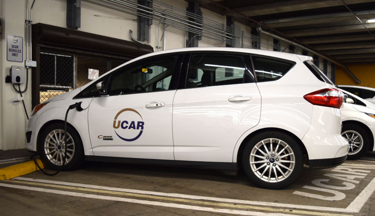 ford cmax ucar hybrid charging at a charging station in central plaza garage