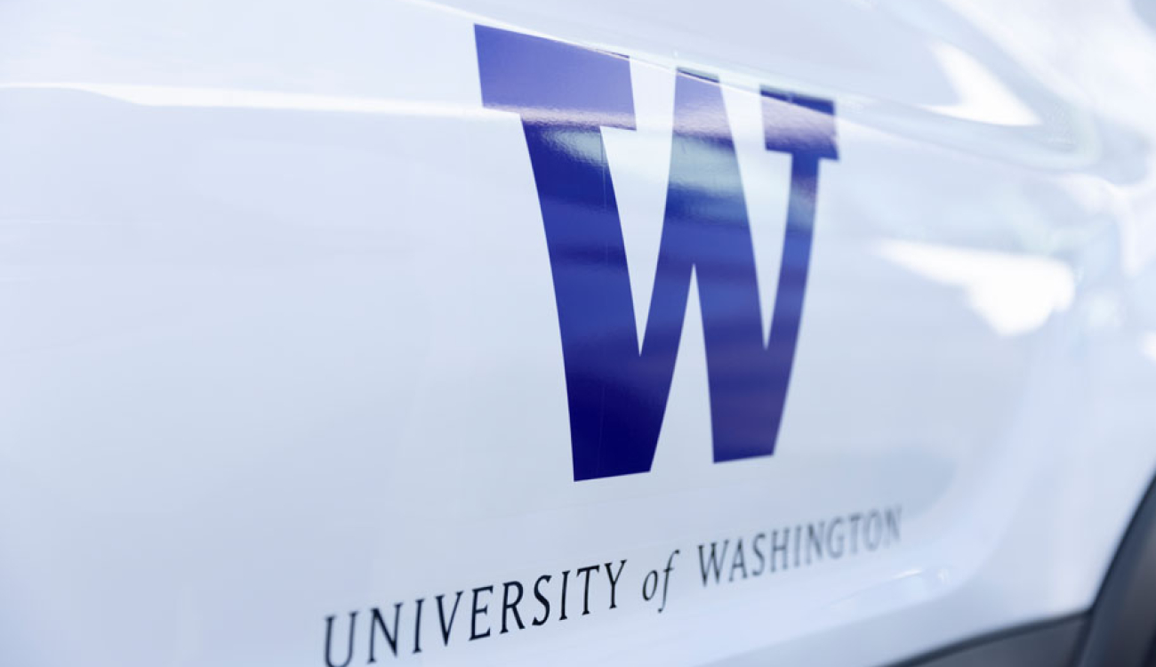 university of washington logo emblazoned on side of fleet vehicle